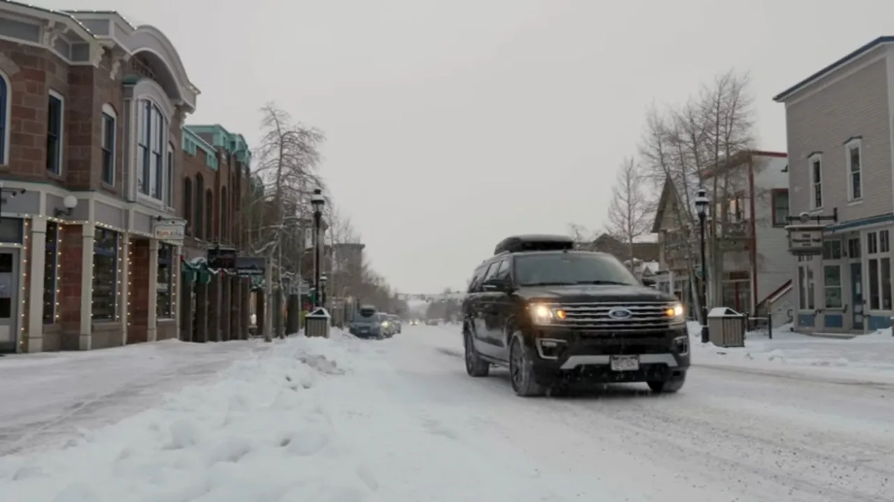 SUV driving at camera Slo Mo